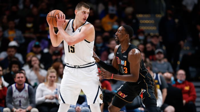 Denver Nuggets center Nikola Jokic (15) controls the ball as Miami Heat center Bam Adebayo (13) guards in the fourth quarter